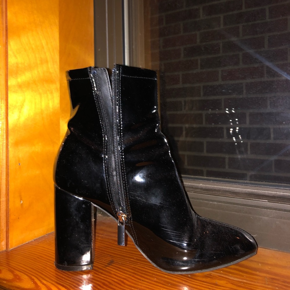 Black heeled boots. Around 3-3.5 inches ?